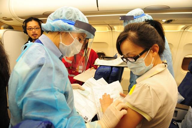 During ”Exercise Hua Shan”, Duty Port Health Officers assessed the health condition of passengers and crew.