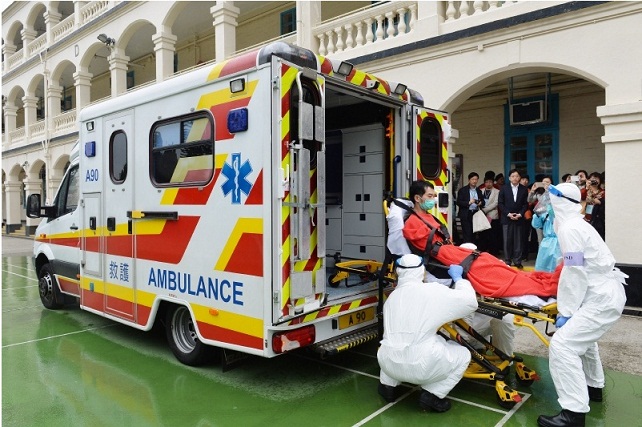 In a simulated drill an ambulance transfers a symptomatic quarantine confinee to the Hospital Authority Infectious Disease Centre.