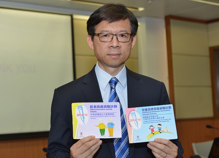 Dr Leung shows the logos of the Elderly Vaccination Subsidy Scheme and the Childhood Influenza Vaccination Subsidy Scheme. Enrolled private doctors should display them near the entrances of their clinics for clients' recognition.